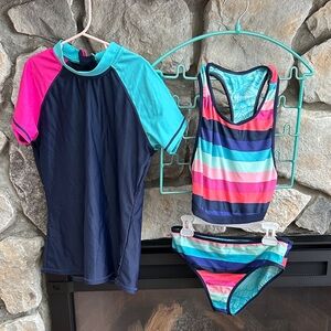 Reversible girls, two-piece bathing suit w/coordinating short sleeve rash guard